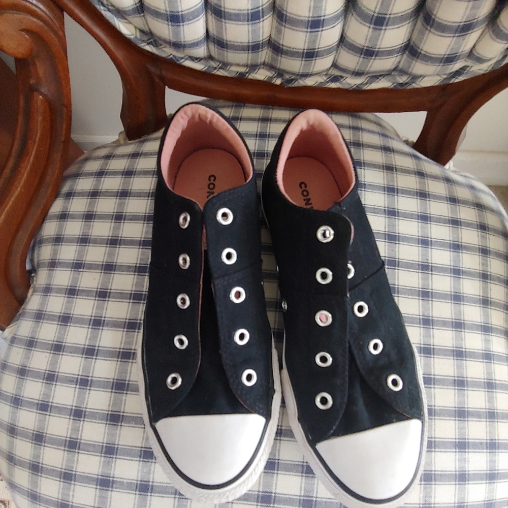 Converse all star tennis shoes in perfect condition.  Slip on style no laces